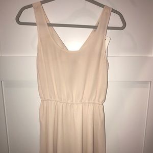 Mini dress with cutout and bow in the back